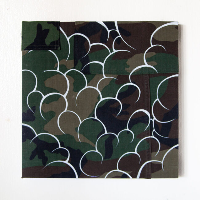 White outlined clouds filled over woodland camouflage pattern